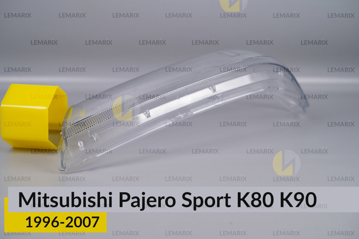 Скло фари Mitsubishi Pajero Sport K80 K90 (1996-2007) ліве