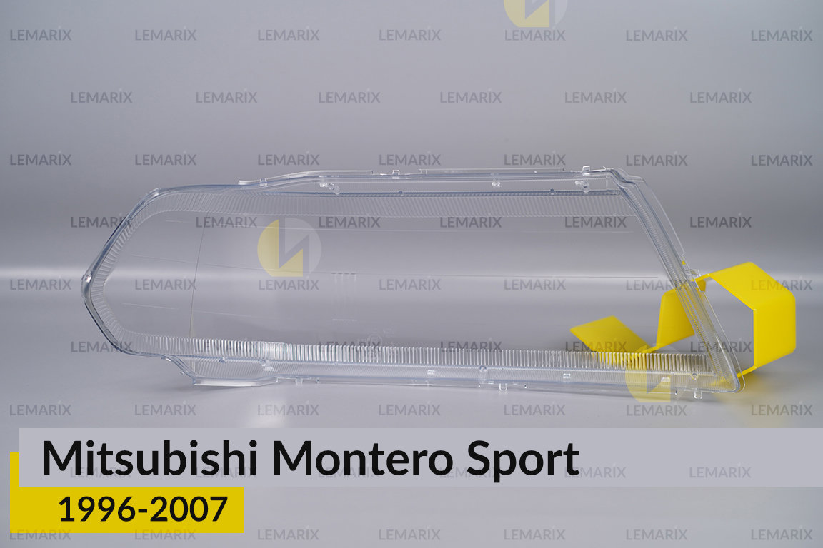 Скло фари Mitsubishi Montero Sport (1996-2007) ліве