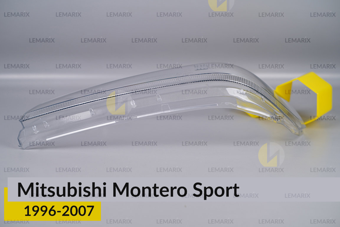 Скло фари Mitsubishi Montero Sport (1996-2007) ліве