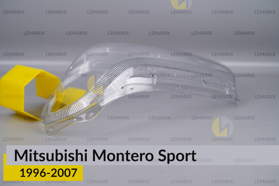 Скло фари Mitsubishi Montero Sport (1996-2007) ліве