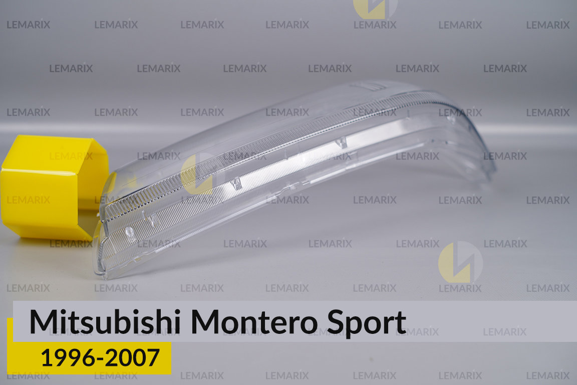 Скло фари Mitsubishi Montero Sport (1996-2007) ліве