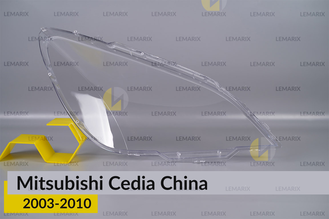 Скло фари Mitsubishi Cedia China (2003-2010) ліве