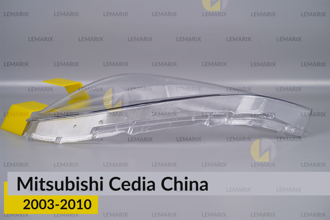 Скло фари Mitsubishi Cedia China (2003-2010) ліве