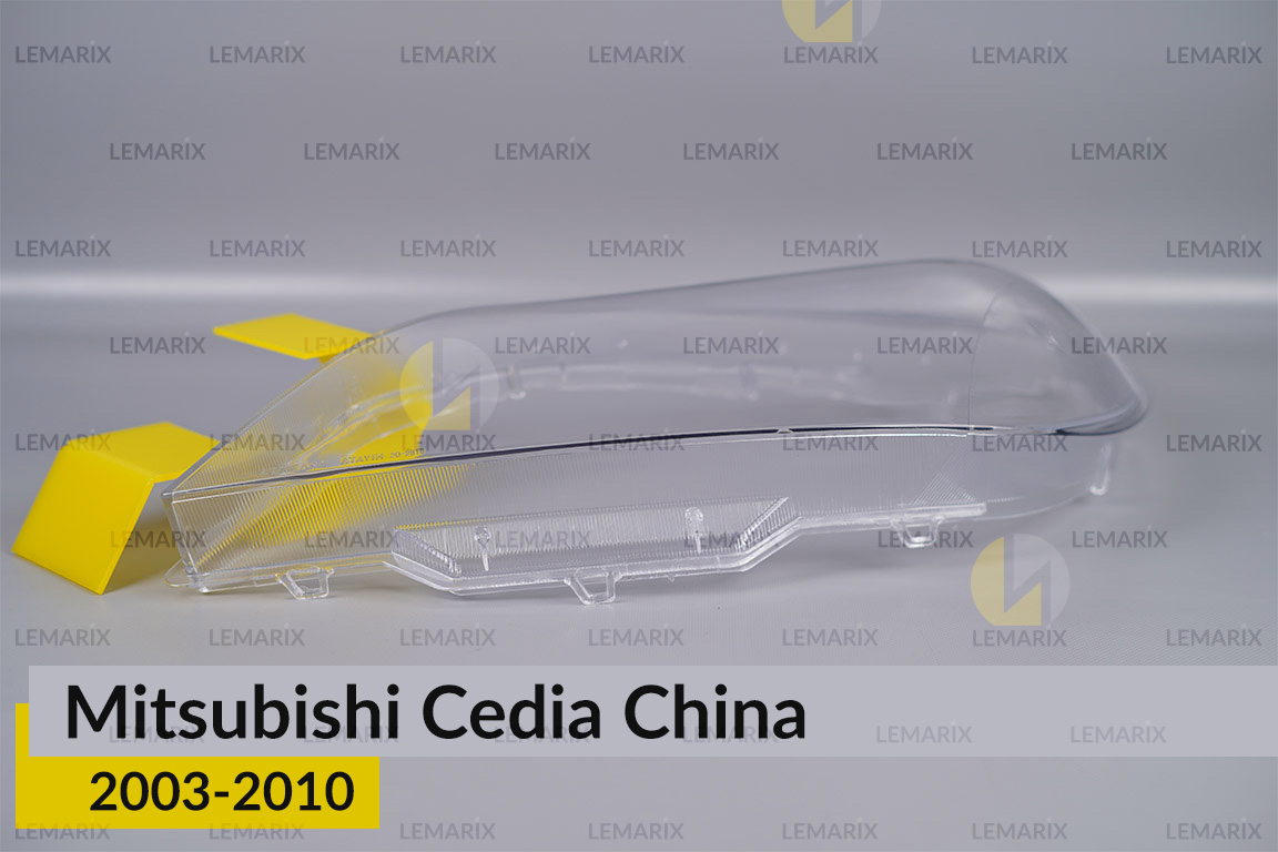 Скло фари Mitsubishi Cedia China (2003-2010) ліве