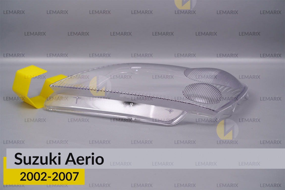 Скло фари Suzuki Aerio (2002-2007) ліве